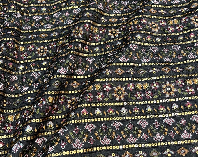 Beautiful black base with multi color stripe style sequence thread embroidered Shantung 45” wide. Best used for home decor. Sold by the yard
