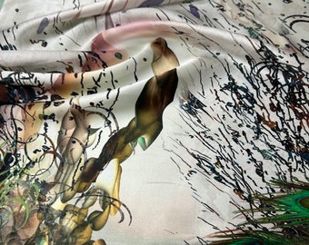 100% silk satin charmeuse digital print 54" wide    Beautiful light gray base with peacock feathers & flower both side border style 54” wide