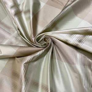 100% silk beautiful mint green tan ivory with gold satin stripe plaids .  silk taffeta 54&quot; wide            Sold by the yard