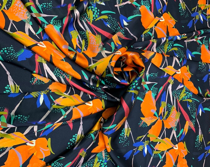 100% silk satin Charmouse digital print 54” wide.  Beautiful black base multi color floral print beat used for apparel.  Sold by the yard