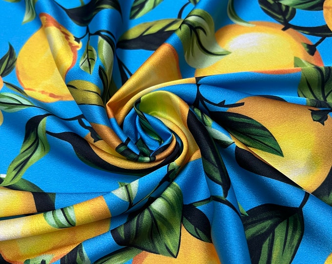 Soft Satin charmeuse digital print 54" wide   Beautiful turquoise base with yellow color lemons branded design   Fabric sold by the yard