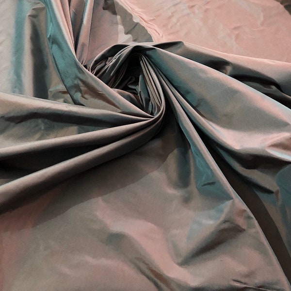 Silk taffeta 54" wide    Beautiful dark steel gray with burnt orange iridescent color silk taffera fabric sold by the yard