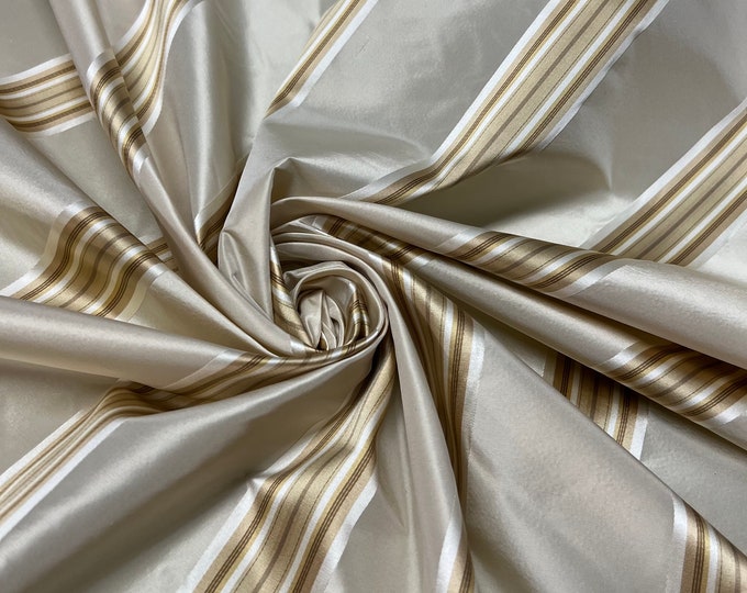 100% silk beautiful beige tan base with gold  satin stripes.  silk satin taffeta 54" wide            Sold by the yard