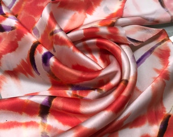 Beautiful 100% silk satin Charmouse digitally printed 54” wide.  Beautiful red purple beige color combination sold by the yard