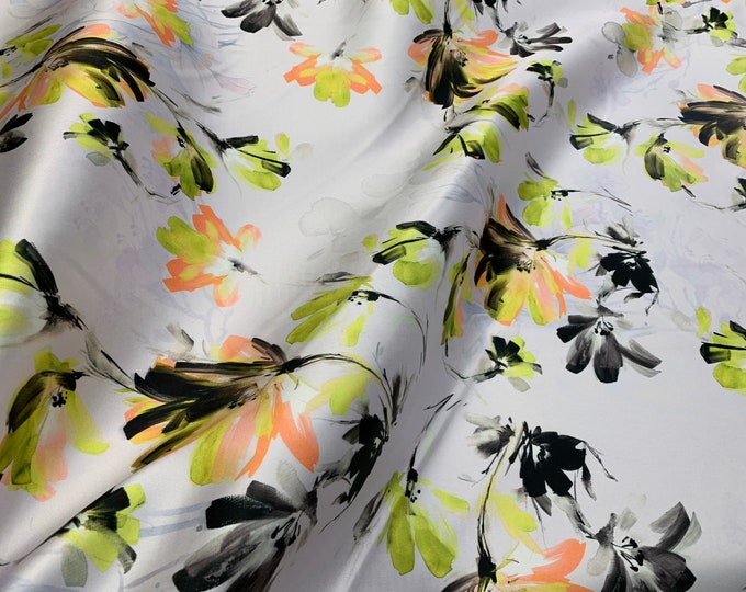 Mikado Zibelline printed fabric 54” wide.  Beautiful offwhite base greenish floral print beat used for apparel.  Sold by the yard