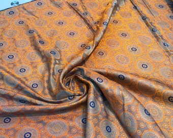 Burnt orange brocade 48" wide   Beautiful burnt orange brocade fabric sold by the yard