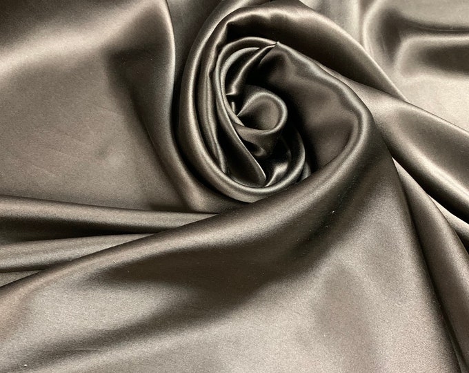 Beautiful dark brown 100% silk satin Charmouse 54” wide. Best used for apparel. Sold by the yard