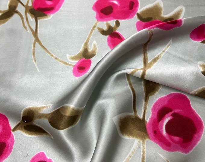 100% silk satin charmeuse digital print 54" wide    Beautiful silver base with shades of Fusia color roses design soft fabric 54” wide