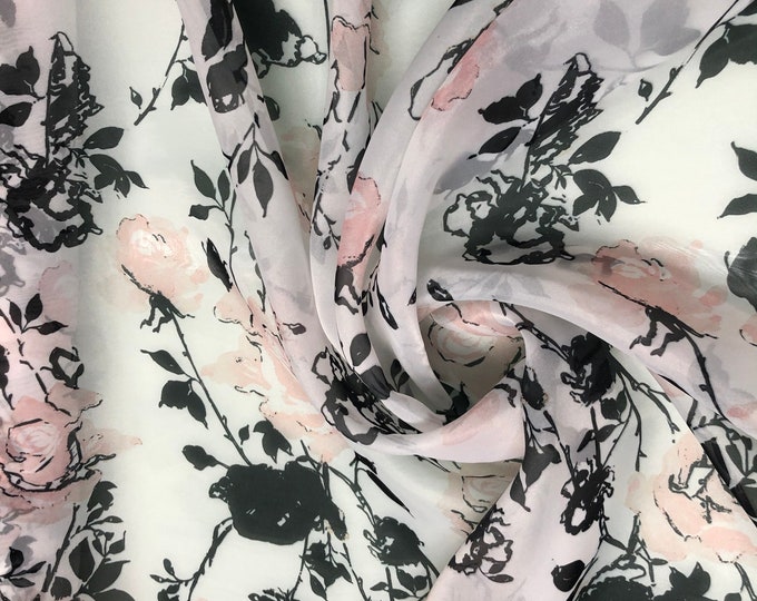 Satin face organza, also called Gazzar 54” wide. Beautiful ivory base with black peach flowers summer design.