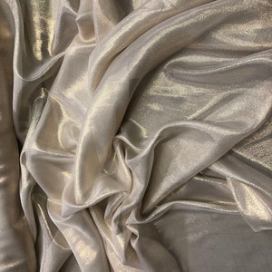 Silk chiffon 54" wide     Matalic gold pinstripe silk chiffon fabric sold by the yard