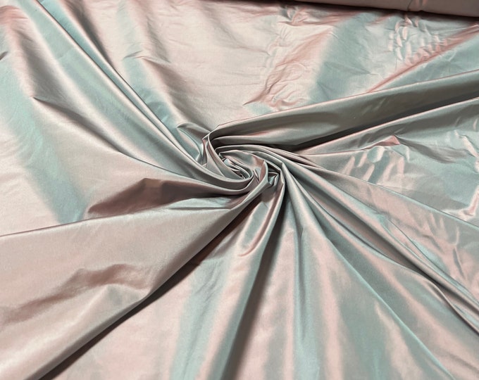 Beautiful lilac grayish Irredescent 100% silk taffeta 54” wide.  Best used for apparel and home Decore.  Sold by the yard