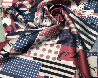 Beautiful abstract design printed silky satin Charmouse 54” wide, beautiful navy ivory copper color combination Sold by the yard.