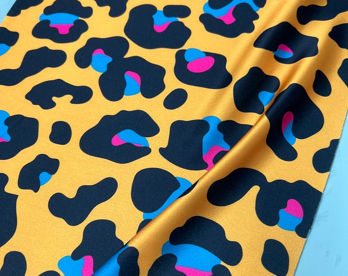 Soft Satin charmeuse digital print 54" wide   Beautiful leopard design mustard yellow base with black Fusia Aqua blue design Fabric