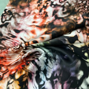 100% silk satin charmeuse digital print 54&quot; wide    Beautiful multi color abstract fire style design soft fabric 54” wide