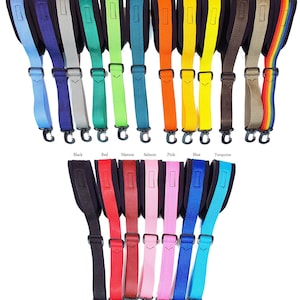 May include: A variety of guitar straps in different colors, including sky blue, purple, silver, green, lime, teal, orange, gold, yellow, brown, tan, rainbow, black, red, maroon, salmon, pink, blue, and turquoise. The straps are made of nylon and have a padded section for comfort.