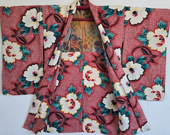 May include: A red and white Japanese kimono with a floral pattern. The kimono is open and the lining is visible. The kimono is made of a lightweight fabric and has a traditional design.