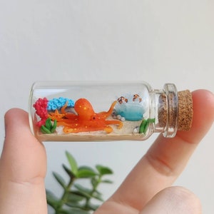 Octopus in different colors in glass-bottle with a coral reef/ unique miniature figure/ handmade artwork