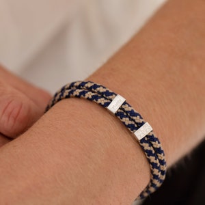 Bracciale da uomo con cordino regolabile nautico e impronta di zampa in argento