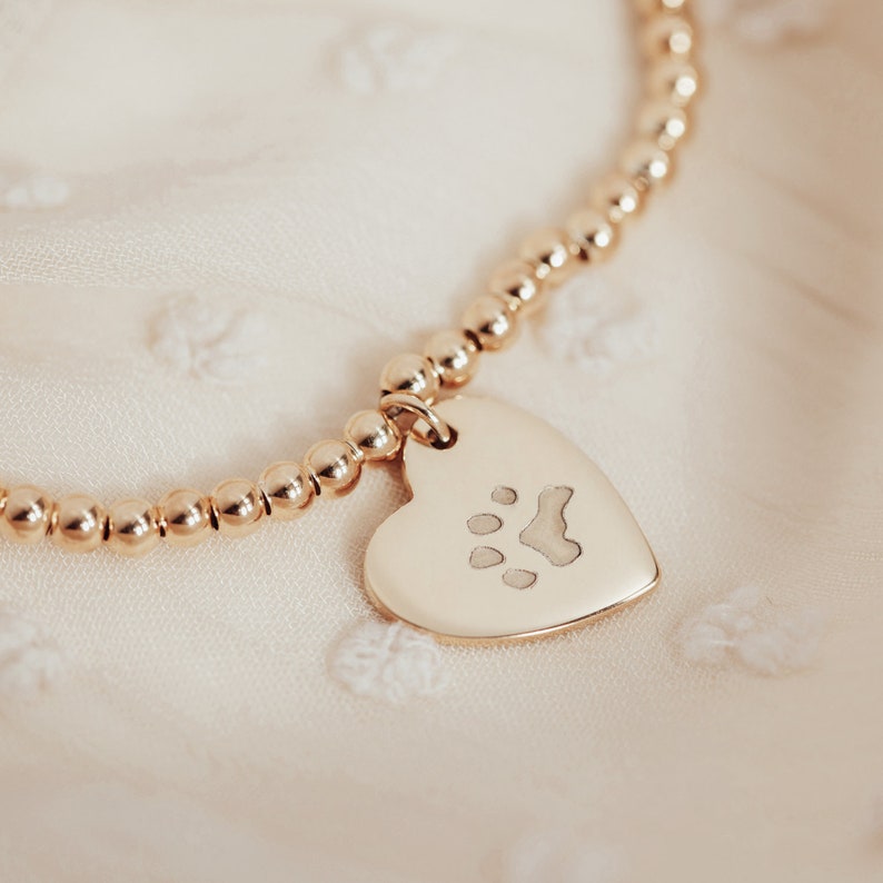 Personalised Gold Plated Engraved Paw Print Heart Charm on a Stretch Bead Bracelet image 1