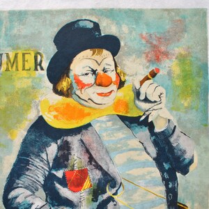 May include: Vintage print of a clown in a black top hat, blue jacket, and striped shirt, smoking a cigar. The clown has a red nose, red cheeks, and a yellow collar. The word "IMER" is visible in the background.