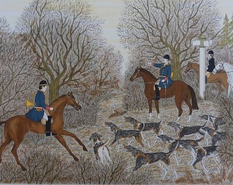May include: A print depicting a fox hunt scene with riders on horseback wearing blue coats and black helmets, accompanied by a pack of hounds in a wooded landscape. The artwork features the signature Vincent Haddelsey in the bottom right corner.