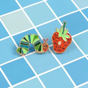 The Very Hungry Caterpillar and Strawberry pin badge set image 1
