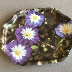 Small Tip Tray with Vibrant Purple and White Flowers on a Leafy Green Background