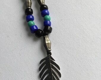 Silver leaf pendant thong necklace