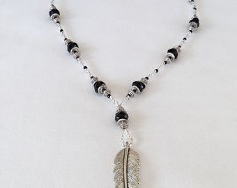 Large silver feather pendant black and silver beaded necklace