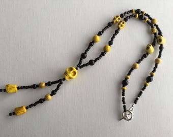 Yellow and black skull necklace
