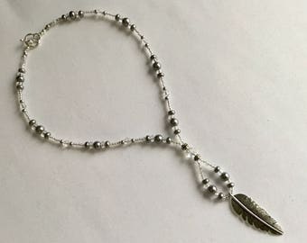 Grey pearl beaded feather pendant necklace