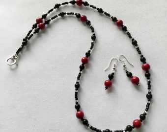 Black and pinky-red beaded necklace with matching earrings
