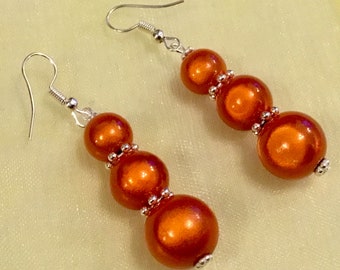 Bright orange beaded earrings