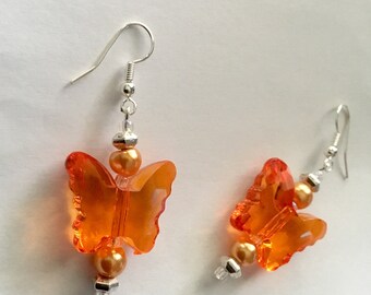 Bright orange butterfly dangly earrings