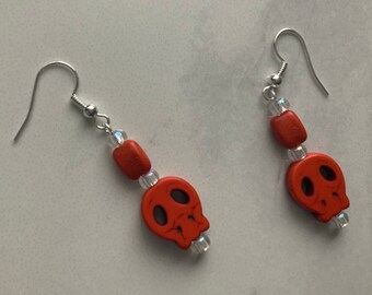 Dangly Orange Skull Earrings