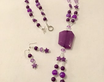 Bright purple beaded necklace with matching earrings
