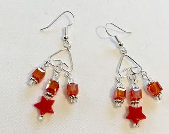 Bright red star dangly earrings
