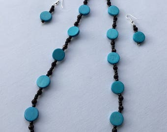 Black and blue beaded necklace with matching earrings.