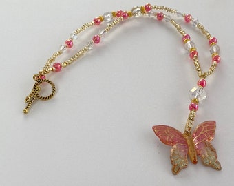 Pretty Pink Beaded Necklace with a Butterfly Pendant