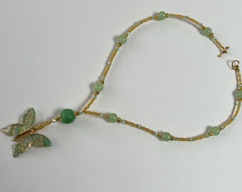 Green Beaded Necklace with a Butterfly Pendant