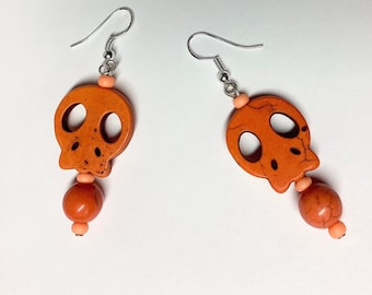 Orange Dangly Skull Earrings