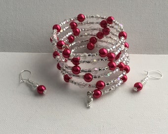 A Beautiful Bright Shiny Pink Beaded Memory Bracelet with earrings