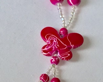 Bright pink butterfly necklace