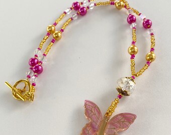 Pink Beaded Necklace With A Butterfly Pendant