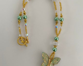Green Beaded Necklace with a Butterfly Pendant