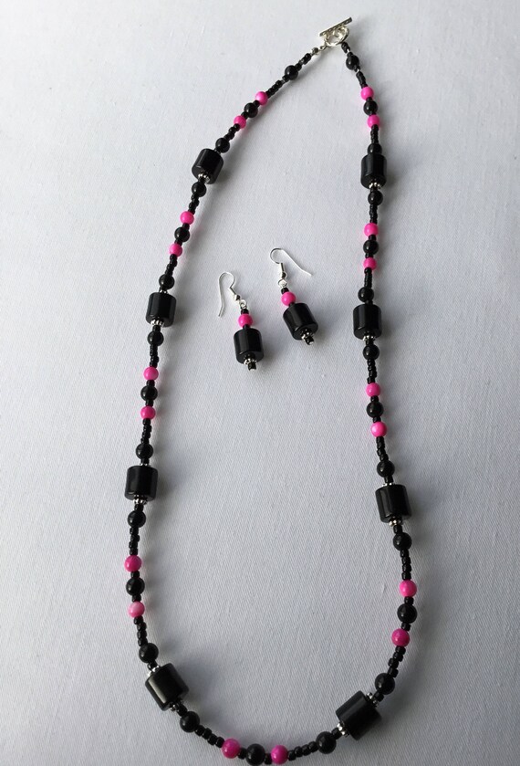 pink and black necklace
