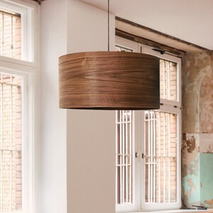 Wood pendant light made of walnut wood perfect for your bedroom or living room. The right choice of modern chandelier will give your space the aura you desire