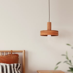 Wood pendant light made of apple chile wood perfect for your bedroom or living room. Ideal for spot light. The right choice of modern chandelier will give your space the aura you desire