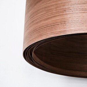 Wood pendant light made of walnut wood perfect for your bedroom or living room. The right choice of modern chandelier will give your space the aura you desire