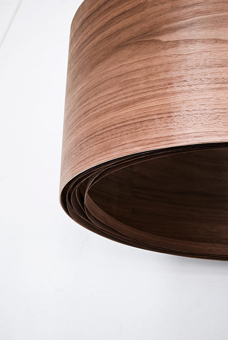 Wood pendant light made of walnut wood perfect for your bedroom or living room. The right choice of modern chandelier will give your space the aura you desire